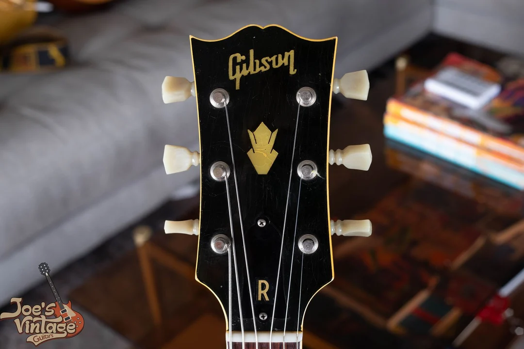 1949 Gibson headstock with early block logo, curved G and connected i dot