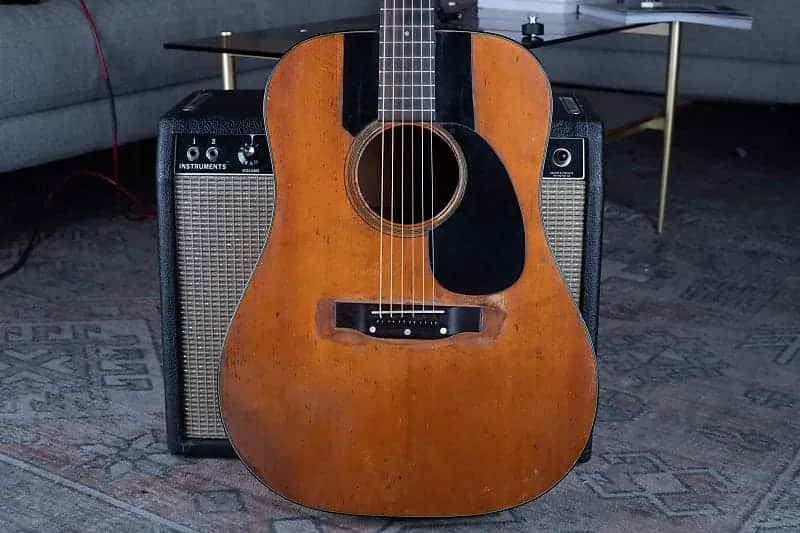 Full front of a heavily played 1951 Martin D-18 showing honest wear across the spruce top