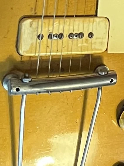 Early Gibson Les Paul combined bridge and tailpiece with strings passing underneath