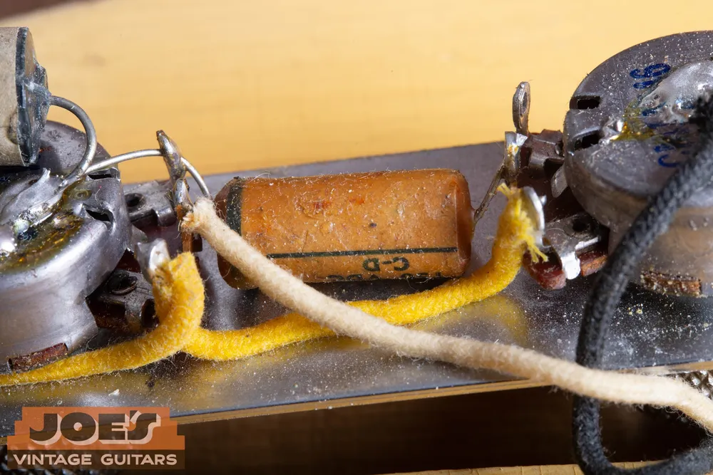 Early blackguard Fender Telecaster capacitor and wiring arrangement