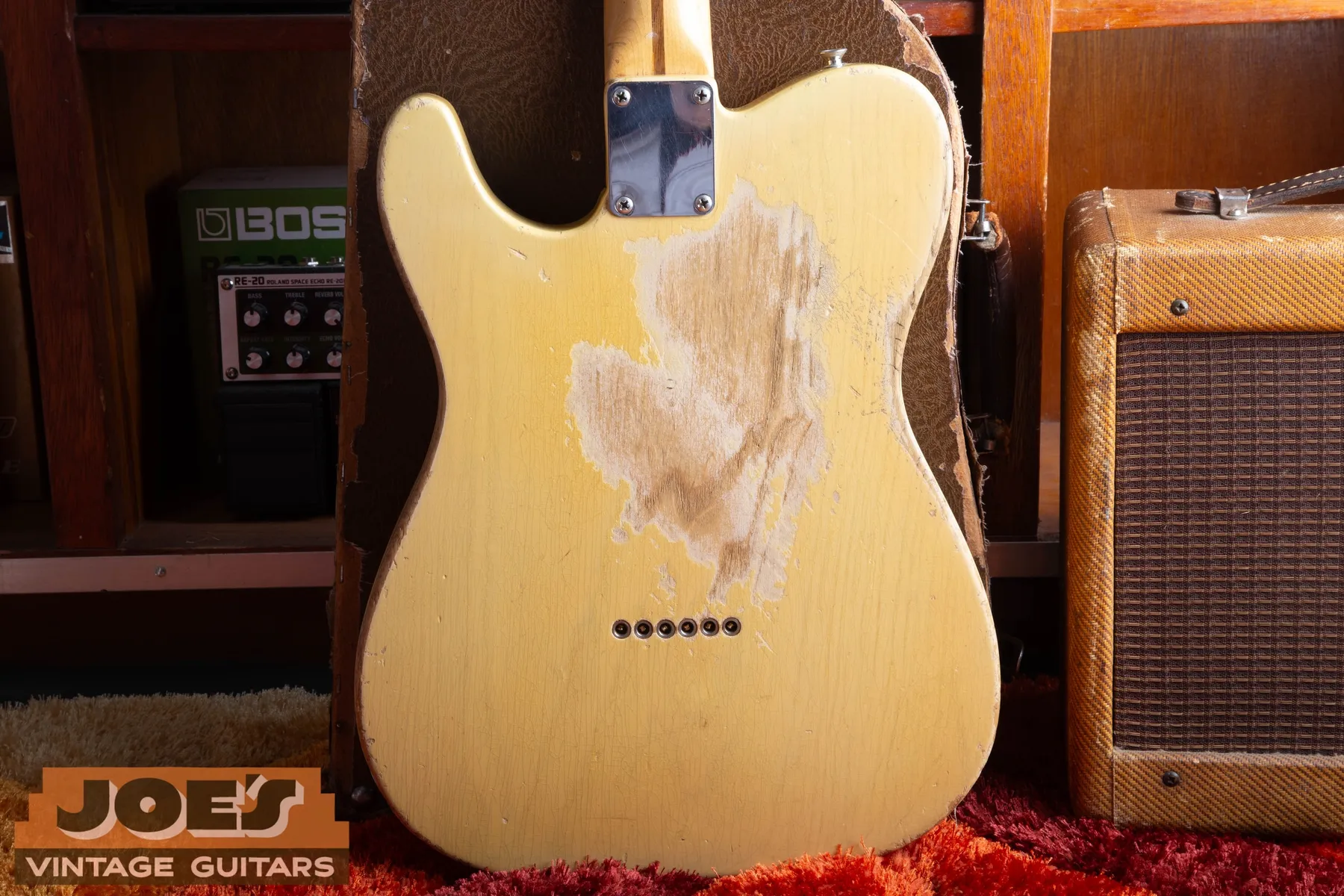 Back of the Telecaster showing substantial finish wear and six string ferrules