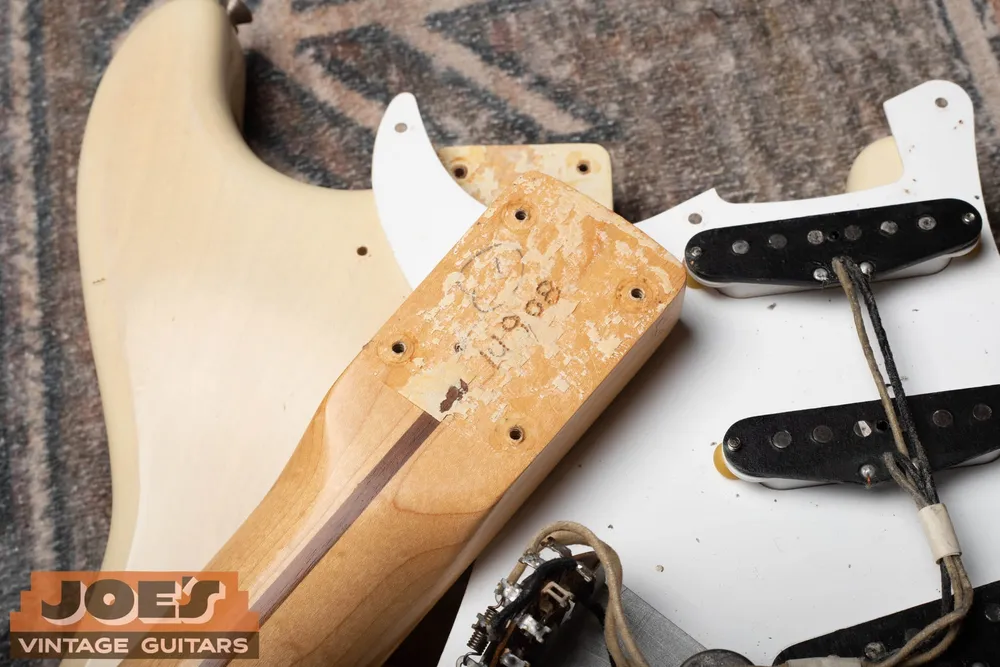 Blonde 1956 Fender Stratocaster with the neck removed to show the neck heel and body