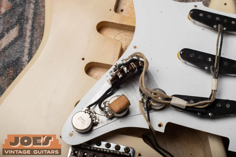 Original electronics and phone-book capacitor inside a blonde 1956 Fender Stratocaster