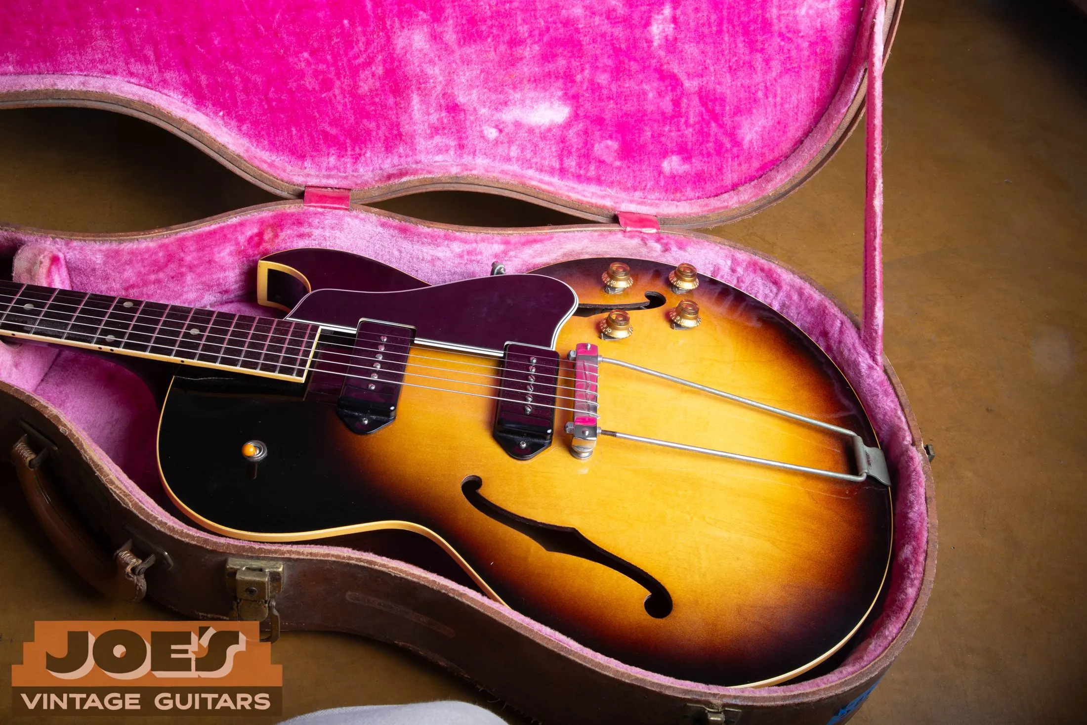 1956 Gibson ES-225TD in case showing long combined bridge and tailpiece