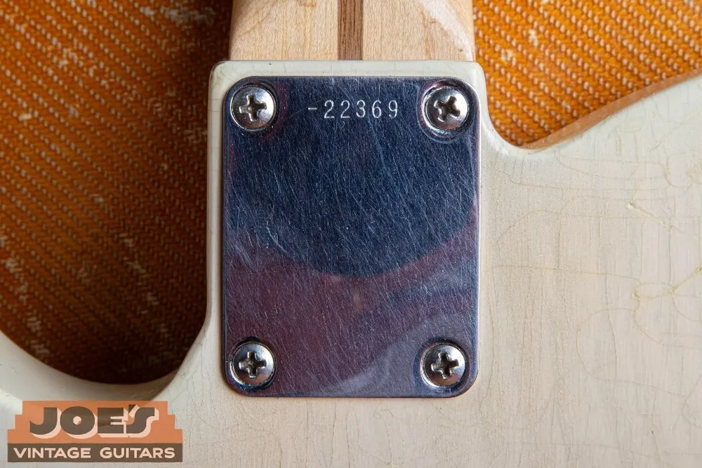 Plain chrome neck plate and serial number on a 1957 Fender Esquire