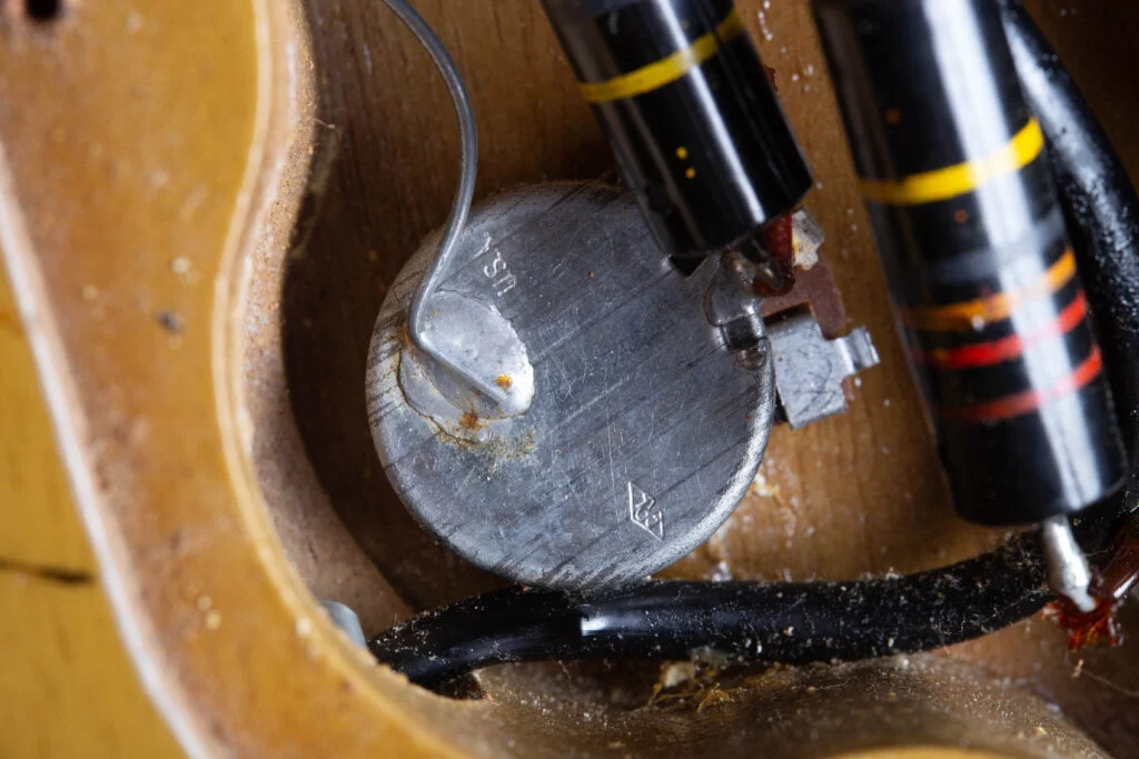 Stamped potentiometer case in a 1958 Gibson Les Paul Special control cavity