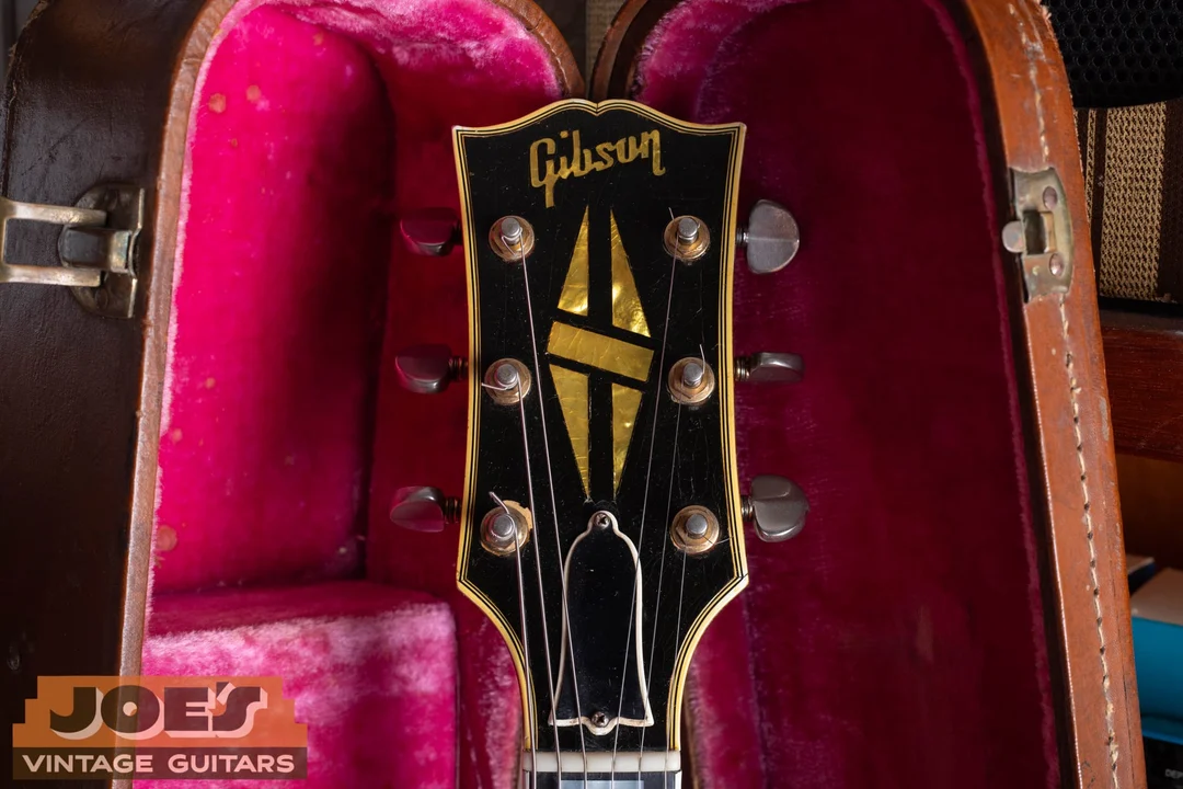 Multi-ply bound Gibson ES-355 headstock with a pearl split-diamond inlay