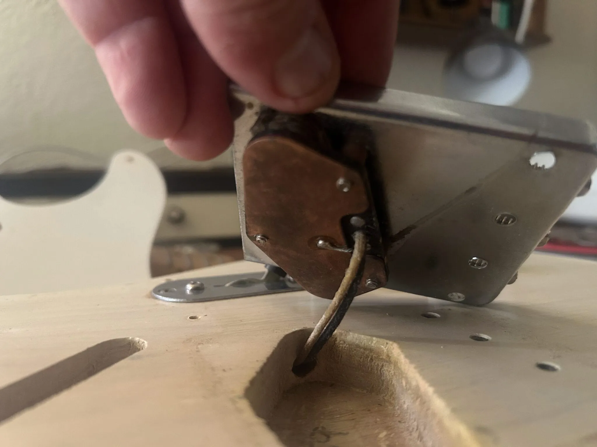 Back of 1959 Fender Telecaster bridge pickup showing chrome baseplate, period-correct construction, and formvar-coated wire leads