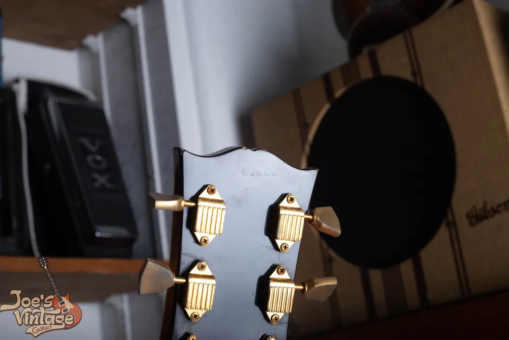 Faint impressed serial on the back of a 1962 Gibson J-200 headstock