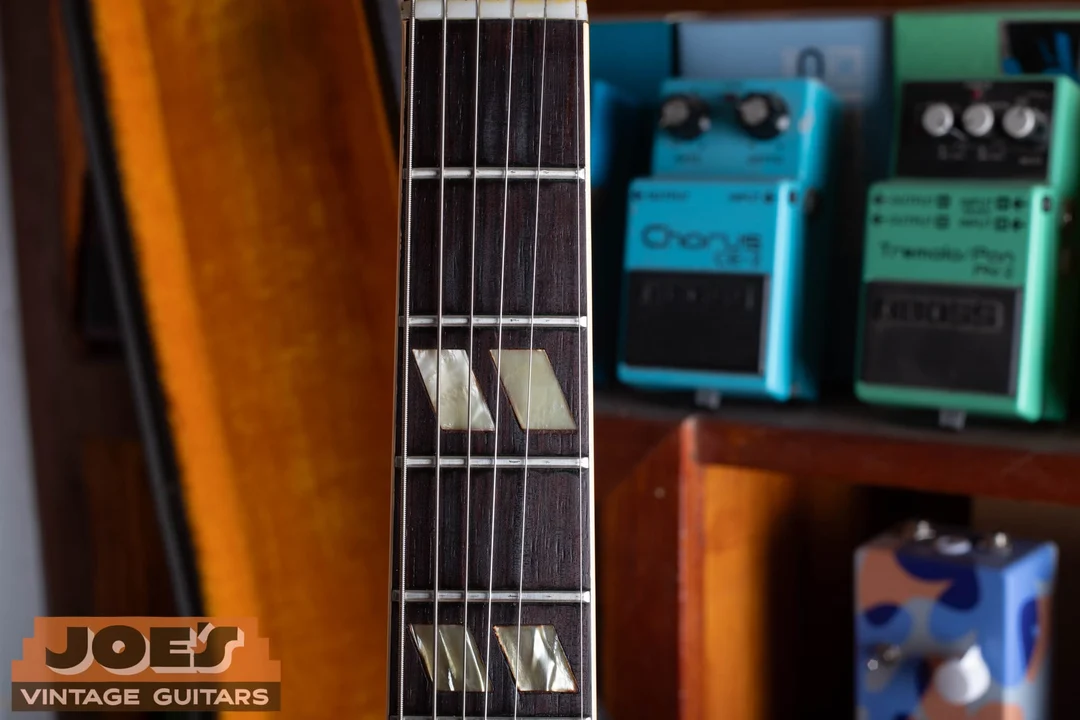 Paired slanted split-parallelogram inlays on a bound rosewood ES-345 fingerboard