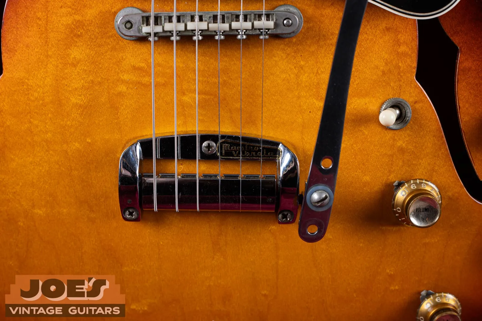 Close up of the short Maestro Vibrola on a 1965 Gibson ES-335, compact tremolo unit and ABR-1 bridge with the surrounding top clean and unmarked