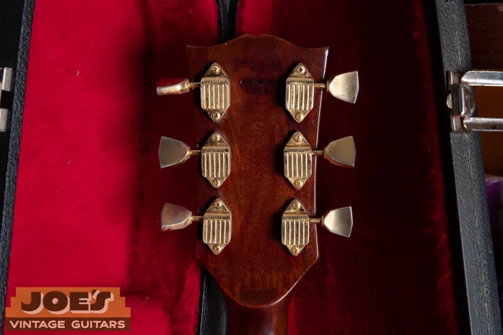 Six-digit Gibson serial 745104 with Made in USA stamped beneath it on an SG Custom headstock