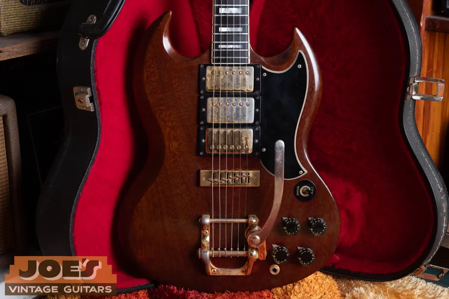 1972 Gibson SG Custom with three humbuckers, block inlays, and gold hardware