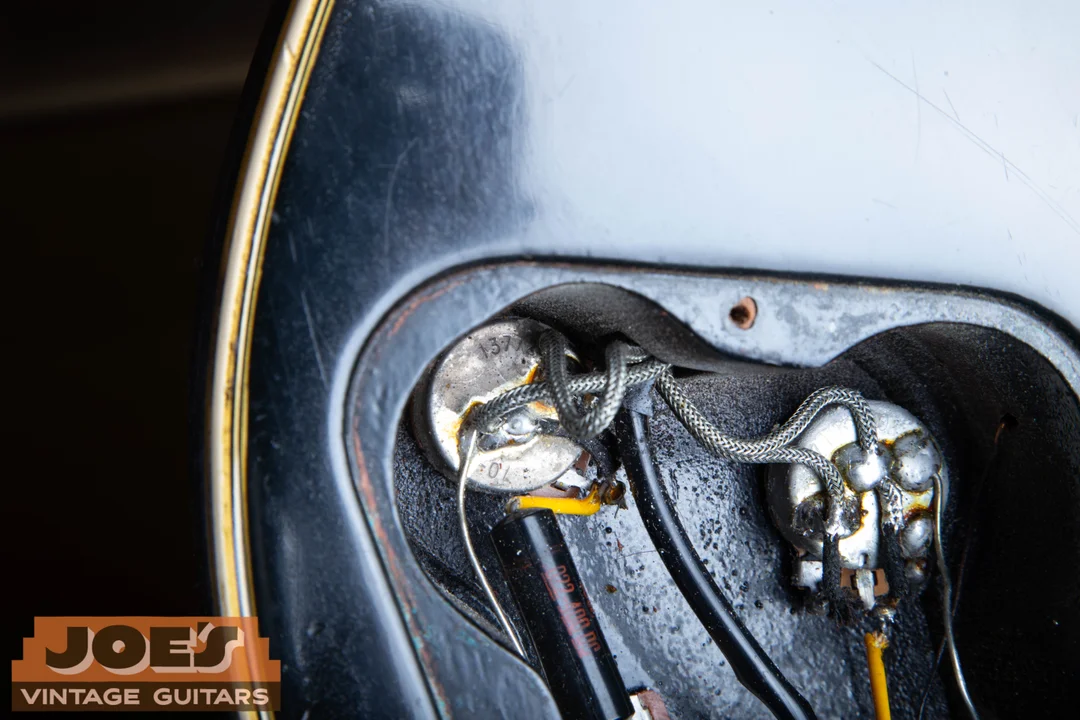 Faint 13772 code on a Gibson CTS pot with braided wiring and solder obscuring the final 20