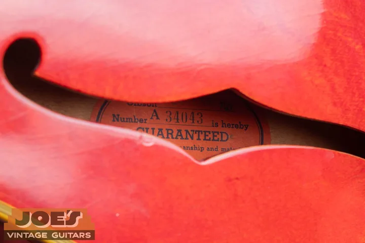 Gibson serial A 34043 on an orange paper label inside the guitar