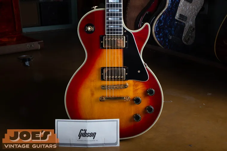 Close view of the Les Paul Custom cherry sunburst finish, pickups and controls