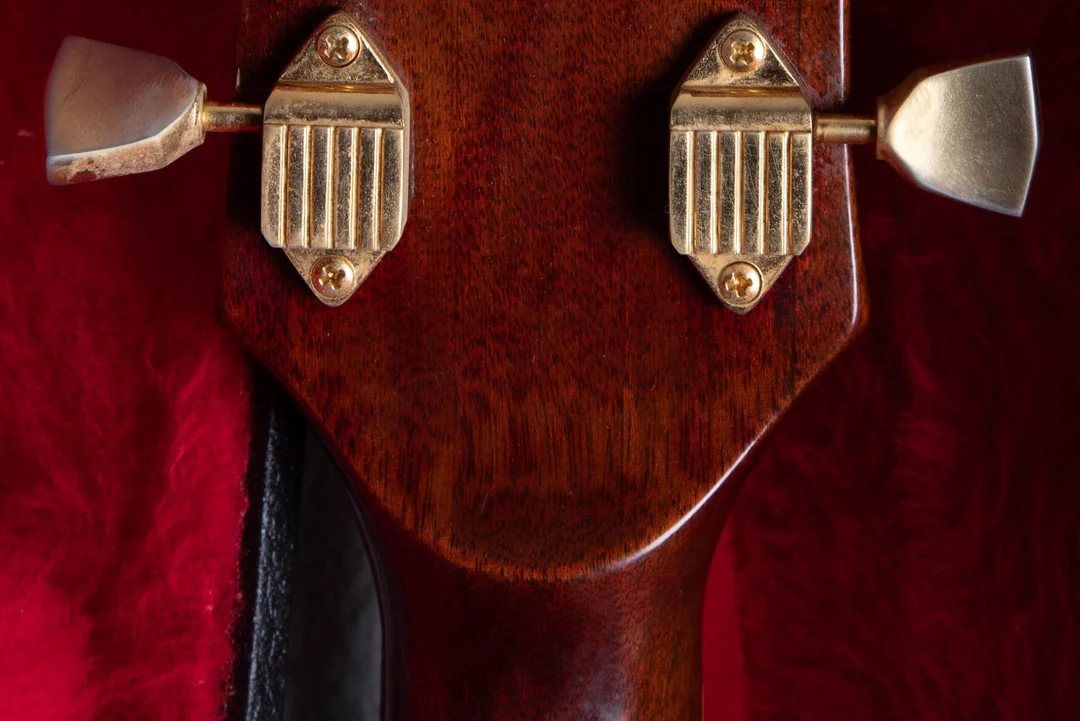 Raised volute behind the nut on a 1972 Gibson SG Custom
