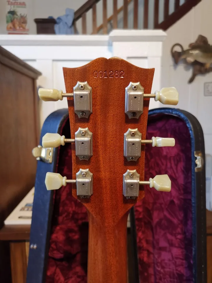Impressed six-digit serial 001282 on a Gibson SG reissue headstock