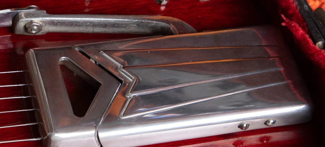 Close view of a Gibson sideways Vibrola on an early SG-style guitar