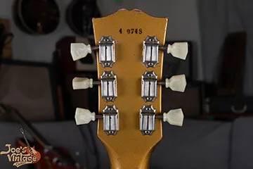 Ink-stamped Gibson serial number on a headstock
