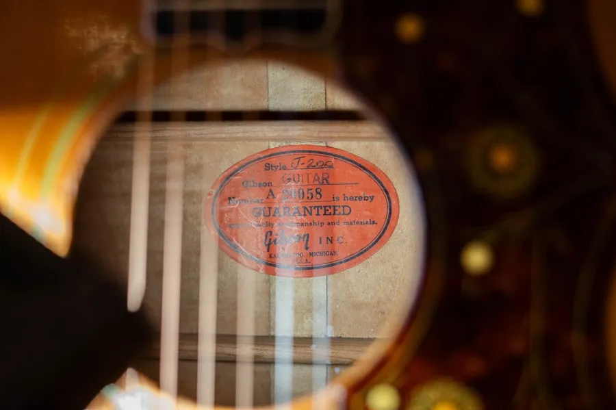 Orange Gibson label inside the 1955 J-200 showing serial A 20058