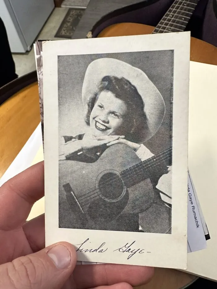 Historic photograph of Linda playing her 1950s Martin 0-18 on the radio