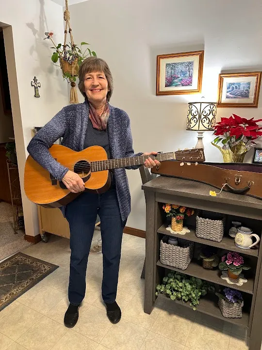 Linda Gayle's niece holding the 1949 Martin 0-18 beside its case