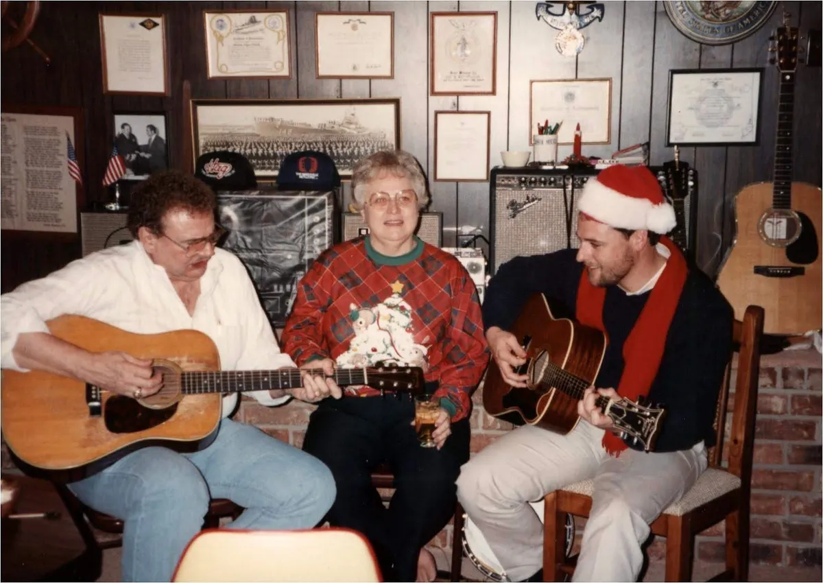 Bill Minnich and family members playing guitars together at Christmas