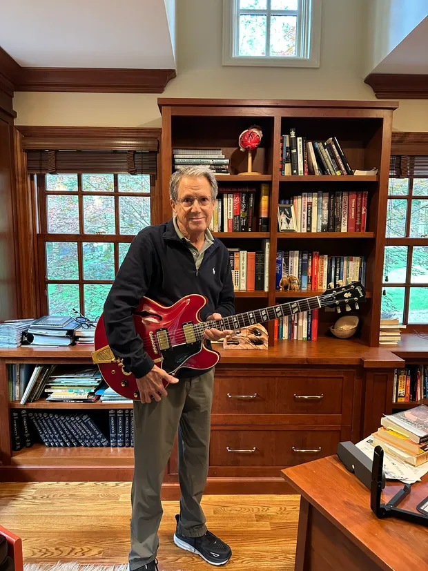 The original owner holding his 1966 Gibson ES-345