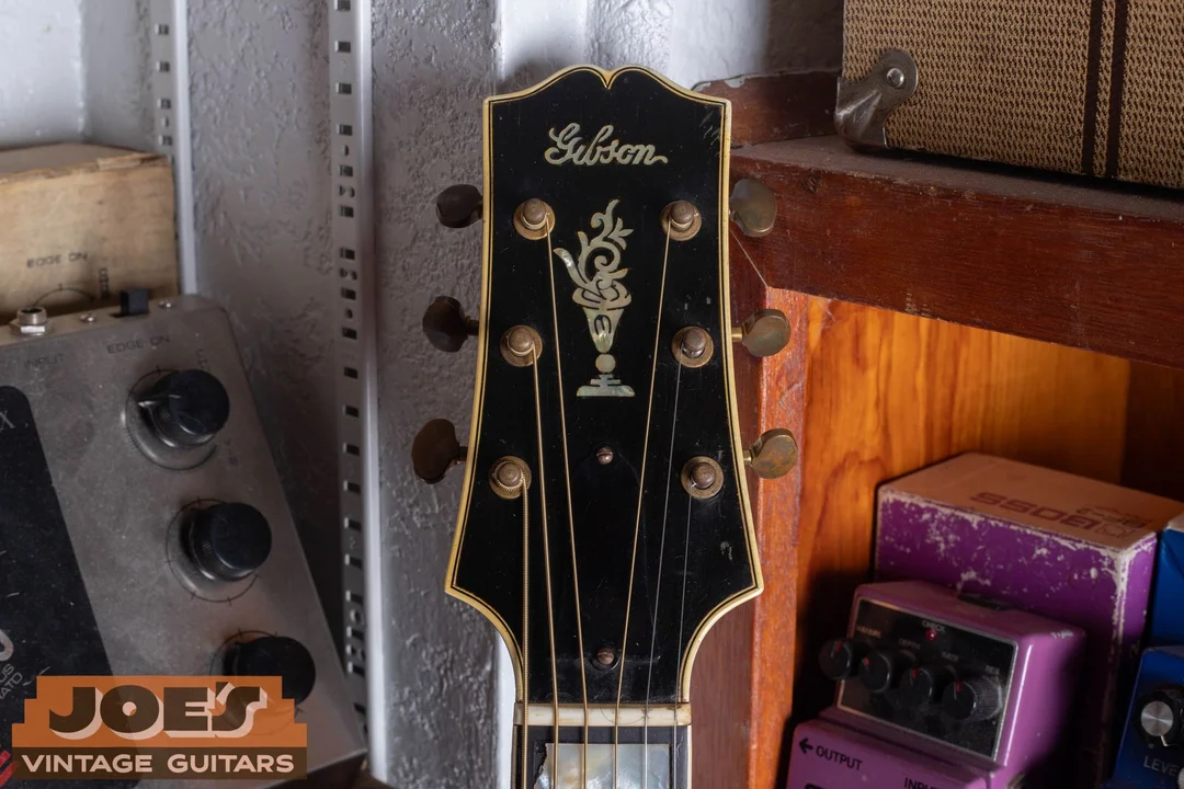 Prewar Gibson headstock with a thin straight Gibson script logo and no word The