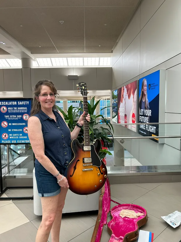 Sylvia's daughter sharing photographs and the story of her mother's 1959 Gibson ES-335